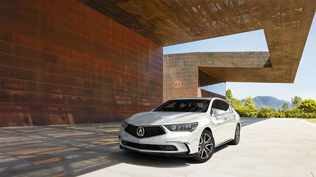2019 Acura TLX driving under freeway overpass